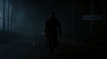 Movie still from “Dark Shadows” (2012), directed by Tim Burton – A man walking down the street in the dark; Wide shot, Low angle
