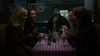 Movie still from “Dark Shadows” (2012), directed by Tim Burton – A group of people sitting at a table with food; Wide shot, Over the shoulder angle