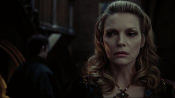 Movie still from “Dark Shadows” (2012), directed by Tim Burton – A person wearing a necklace; Close Up shot, Over the shoulder angle