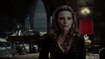Movie still from “Dark Shadows” (2012), directed by Tim Burton – A woman with long blonde hair wearing a black dress; Medium shot, Over the shoulder angle