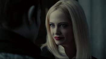 Movie still from “Dark Shadows” (2012), directed by Tim Burton – A woman with blonde hair and red lipstick; Close Up shot, Over the shoulder angle