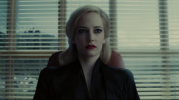 Movie still from “Dark Shadows” (2012), directed by Tim Burton – A woman with blonde hair and red lipstick sitting in a chair; Close Up shot, Over the shoulder angle