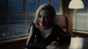 Movie still from “Dark Shadows” (2012), directed by Tim Burton – A woman sitting at a table in front of a window; Close Up shot, Over the shoulder angle