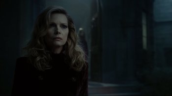 Movie still from “Dark Shadows” (2012), directed by Tim Burton – A woman with long blonde hair wearing a black jacket; Close Up shot, Over the shoulder angle