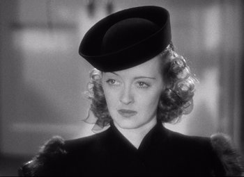 Movie still from “Dark Victory” (1939), directed by Edmund Goulding – A black and white photo of a woman wearing a hat; Close Up shot, Low angle