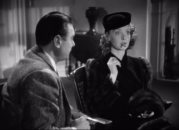 Movie still from “Dark Victory” (1939), directed by Edmund Goulding – A man and a woman sitting in a room; Medium shot, Over the shoulder angle