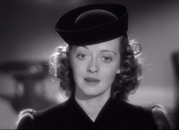 Movie still from “Dark Victory” (1939), directed by Edmund Goulding – A black and white photo of a woman wearing a hat; Close Up shot, Low angle