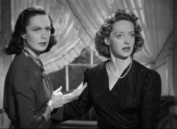 Movie still from “Dark Victory” (1939), directed by Edmund Goulding – A black - and - white photo of two women standing next to each other; Medium shot, High angle