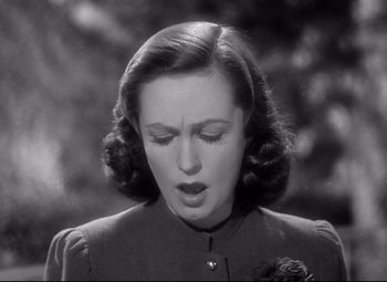 Movie still from “Dark Victory” (1939), directed by Edmund Goulding – An old black and white photo of a woman; Close Up shot, Low angle