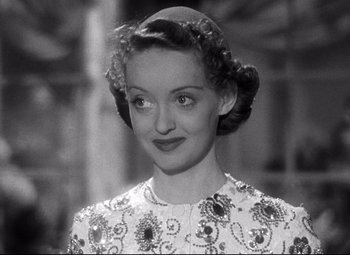 Movie still from “Dark Victory” (1939), directed by Edmund Goulding – An old black and white photo of a woman; Close Up shot, High angle