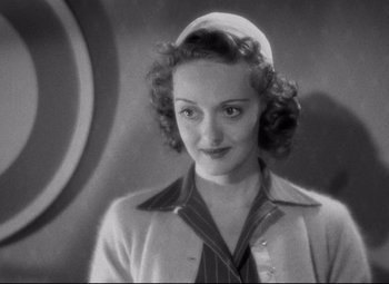 Movie still from “Dark Victory” (1939), directed by Edmund Goulding – An old black and white photo of a woman in a hat; Close Up shot, High angle