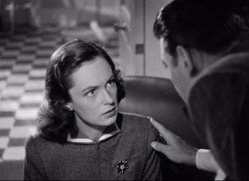 Movie still from “Dark Victory” (1939), directed by Edmund Goulding – An old photo of a man and a woman talking to each other; Close Up shot, Over the shoulder angle