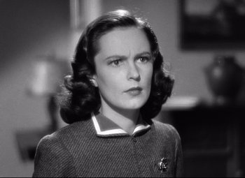 Movie still from “Dark Victory” (1939), directed by Edmund Goulding – An old photo of a woman in a suit; Close Up shot, Low angle