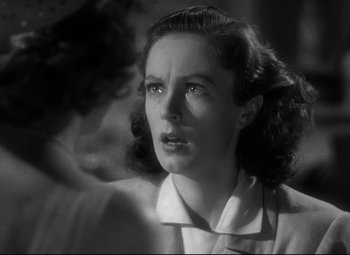 Movie still from “Dark Victory” (1939), directed by Edmund Goulding – An old black and white photo of a woman; Close Up shot, Low angle