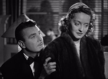 Movie still from “Dark Victory” (1939), directed by Edmund Goulding – A man and a woman standing next to each other; Close Up shot, Low angle