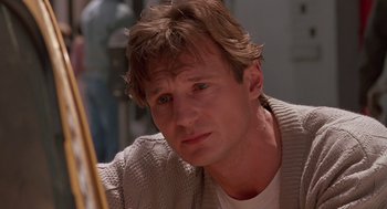 Movie still from “Darkman” (1990), directed by Sam Raimi – A person wearing a white shirt; Close Up shot, Low angle