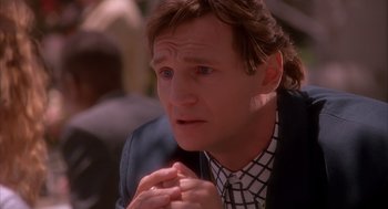 Movie still from “Darkman” (1990), directed by Sam Raimi – A person with his hands clasped together; Close Up shot, Over the shoulder angle