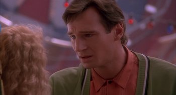 Movie still from “Darkman” (1990), directed by Sam Raimi – A person wearing a red shirt; Close Up shot, Over the shoulder angle