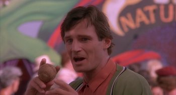 Movie still from “Darkman” (1990), directed by Sam Raimi – A person holding a ball; Close Up shot, Low angle