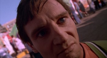 Movie still from “Darkman” (1990), directed by Sam Raimi – A man's face with blue eyes; Extreme Close Up shot, Low angle