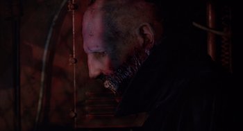A person with a face covered in blood