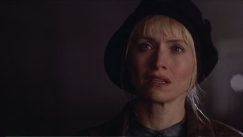 Movie still from “Darkman III: Die Darkman Die” (1996), directed by Bradford May – A person wearing a hat; Close Up shot, Over the shoulder angle