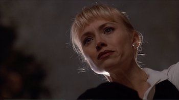 Movie still from “Darkman III: Die Darkman Die” (1996), directed by Bradford May – A person with blond hair; Close Up shot, Low angle