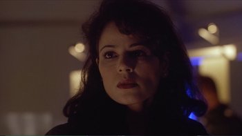 Movie still from “Darkman III: Die Darkman Die” (1996), directed by Bradford May – A person looking at the camera; Close Up shot, Low angle