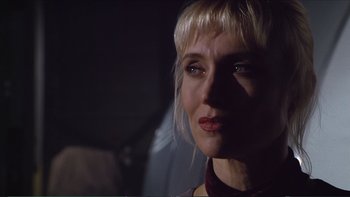 Movie still from “Darkman III: Die Darkman Die” (1996), directed by Bradford May – A person wearing a red shirt; Close Up shot, Over the shoulder angle