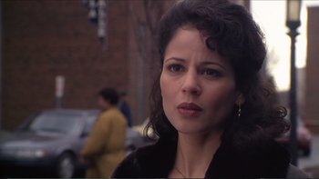 Movie still from “Darkman III: Die Darkman Die” (1996), directed by Bradford May – A person wearing a black jacket; Close Up shot, Over the shoulder angle