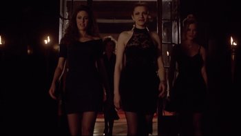 Movie still from “Darkman II: The Return of Durant” (1995), directed by Bradford May – A group of women walking down a hall way; Medium shot, Low angle