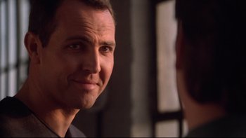 Movie still from “Darkman II: The Return of Durant” (1995), directed by Bradford May – A person looking at a mirror; Close Up shot, Low angle