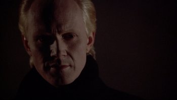 Movie still from “Darkman II: The Return of Durant” (1995), directed by Bradford May – A person with blond hair; Close Up shot, Low angle