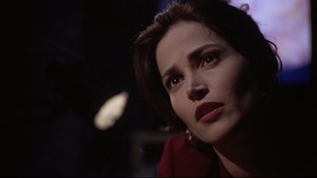 Movie still from “Darkman II: The Return of Durant” (1995), directed by Bradford May – A person with a red shirt; Close Up shot, Over the shoulder angle