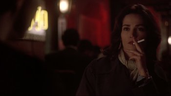 Movie still from “Darkman II: The Return of Durant” (1995), directed by Bradford May – A person wearing a jacket; Close Up shot, Over the shoulder angle