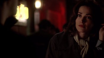 Movie still from “Darkman II: The Return of Durant” (1995), directed by Bradford May – A person wearing a jacket; Close Up shot, Over the shoulder angle