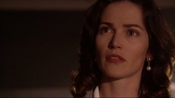 Movie still from “Darkman II: The Return of Durant” (1995), directed by Bradford May – A person looking at the camera; Close Up shot, Low angle