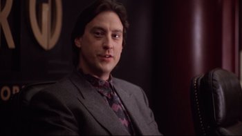 Movie still from “Darkman II: The Return of Durant” (1995), directed by Bradford May – A person wearing a suit and tie; Close Up shot, Low angle