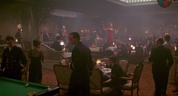 Movie still from “Das Boot” (1981), directed by Wolfgang Petersen – A group of people sitting in a room with tables; Wide shot, High angle