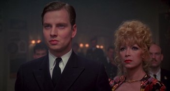 Movie still from “Das Boot” (1981), directed by Wolfgang Petersen – A man and a woman standing next to each other; Close Up shot, Low angle