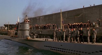 Movie still from “Das Boot” (1981), directed by Wolfgang Petersen – A group of people standing on top of a boat; Extreme Wide shot, High angle