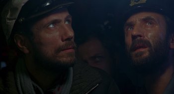 Movie still from “Das Boot” (1981), directed by Wolfgang Petersen – Two men looking into the distance in the dark; Close Up shot, Low angle