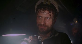 Movie still from “Das Boot” (1981), directed by Wolfgang Petersen – A person wearing a hat; Close Up shot, Low angle