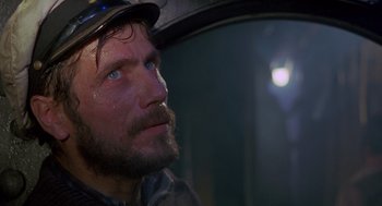 Movie still from “Das Boot” (1981), directed by Wolfgang Petersen – A person wearing a hat; Close Up shot, Low angle