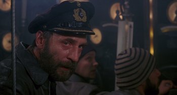 Movie still from “Das Boot” (1981), directed by Wolfgang Petersen – A person wearing a hat; Close Up shot, Low angle