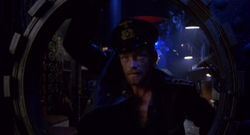 Movie still from “Das Boot” (1981), directed by Wolfgang Petersen – A man wearing a hat and a leather jacket; Medium shot, Low angle