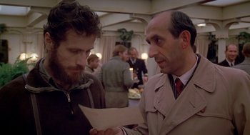 Movie still from “Das Boot” (1981), directed by Wolfgang Petersen – Two men are looking at a piece of paper; Close Up shot, Over the shoulder angle