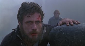 Movie still from “Das Boot” (1981), directed by Wolfgang Petersen – A person with a head wound; Close Up shot, Low angle