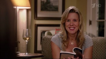 Movie still from “Date Night” (2010), directed by Shawn Levy – A woman sitting at a table with a glass of white wine; Close Up shot, Over the shoulder angle