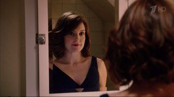 Movie still from “Date Night” (2010), directed by Shawn Levy – A woman looking into a mirror in a bathroom; Close Up shot, Over the shoulder angle